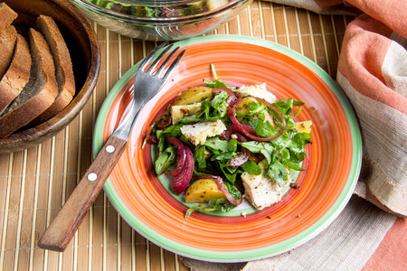 Rustic salad with chicken, lettuce, potatoes, marinated onion, healthy lunchの写真素材