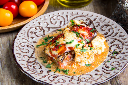 Parmigiano with tomatoes, eggplant, cheese, meat, chicken, traditional dish, delicious homemade foodの写真素材