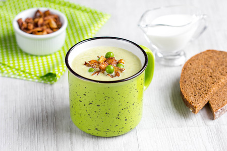 Cream soup of green peas, broccoli, spinach with crispy onion fries in Ñup, tasty foodの写真素材