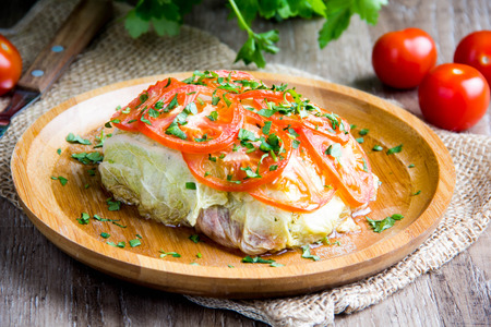Cabbage rolls, stuffed with tomatoes, fish, meat, vegetables, a delicious Russian dish, tasty healthy diet foodの写真素材