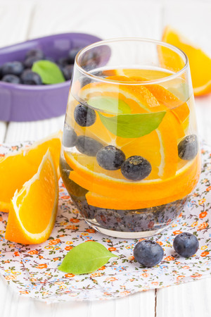 Water with orange and blueberry, tasty summer healthy soft drinkの写真素材