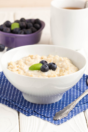 Oatmeal porridge with blueberries, delicious and healthy breakfastの写真素材