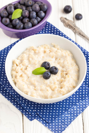 Oatmeal porridge with blueberries, delicious and healthy breakfastの写真素材