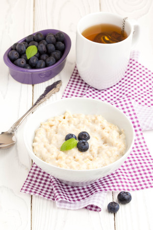 Oatmeal porridge with blueberries, delicious and healthy breakfastの写真素材