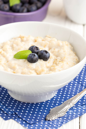 Oatmeal porridge with blueberries, delicious and healthy breakfastの写真素材