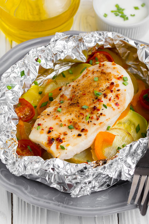 Baked chicken fillet with vegetables, delicious dinnerの写真素材