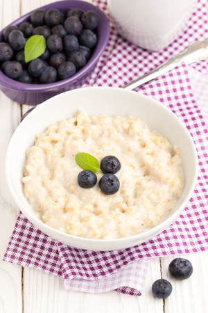 Oatmeal porridge with blueberries, delicious and healthy breakfastの写真素材