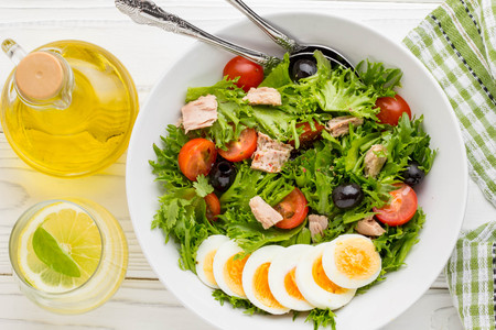 Salad with tuna, egg, cherry tomatoes, olives, oilの写真素材