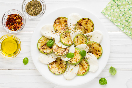 Salad slices of fried zucchini with mozzarella, light summer snackの写真素材