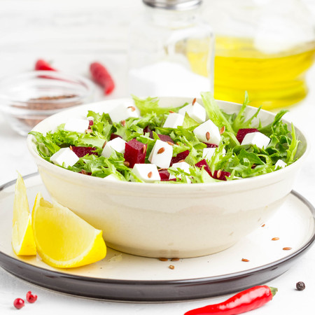 Tasty alad with lettuce, boiled beets, feta cheese, flax seeds and lemonの写真素材