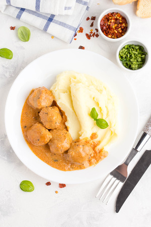 Meatballs with mashed potatoes, creamy tomato sauce, classic delicious foodの写真素材