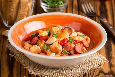 Stew with chicken, sausages, beans, tomatoes, homemade autumn dishの写真素材