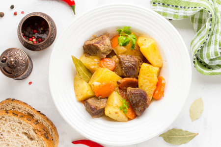 Beef stew with vegetables potatoes, carrots, delicious autumn dish, gravy sauceの写真素材