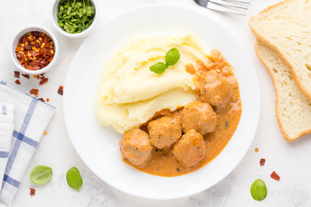Meatballs with mashed potatoes, creamy tomato sauce, classic delicious foodの写真素材