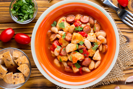 Stew with chicken, sausages, beans, tomatoes, homemade autumn dishの写真素材