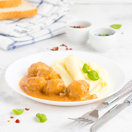 Meatballs with mashed potatoes, creamy tomato sauce, classic delicious foodの写真素材