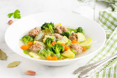 Vegetable soup with beef meatballs, carrots, cabbage, zucchini, broccoli, tatsy healthy homemade lunchの写真素材