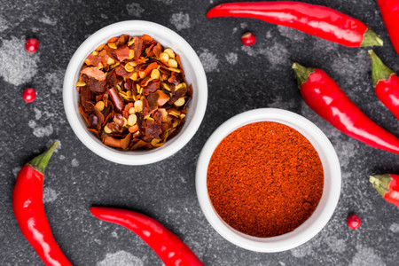 Whole chili pepper, flakes, powder, hot spicy seasoning for dishesの写真素材