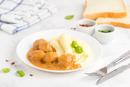 Meatballs with mashed potatoes, creamy tomato sauce, classic delicious foodの写真素材