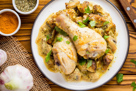 Chicken legs in creamy mushroom sauce, delicious dinnerの写真素材