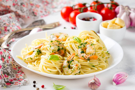 Italian pasta, spaghetti with shrimp, herbs, garlic and cheese. Delicious healthy foodの写真素材