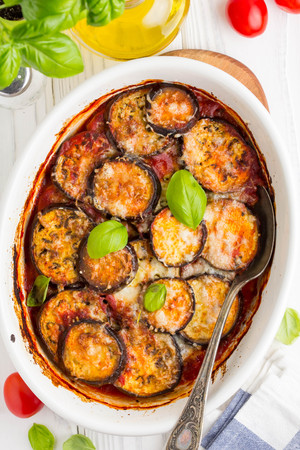 Eggplant casserole with tomato sauce, white cheese, delicious summer stewの写真素材