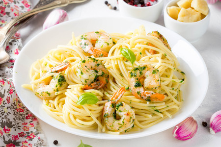 Italian pasta, spaghetti with shrimp, herbs, garlic and cheese. Delicious healthy foodの写真素材