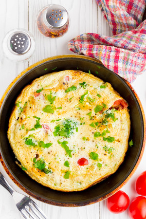 Omelet with broccoli and tomato, delicious healthy Breakfast, traditional morning food for childrenの写真素材
