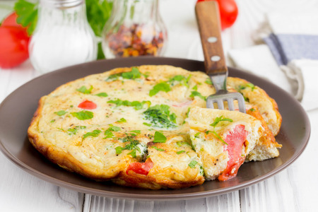 Omelet with broccoli and tomato, delicious healthy Breakfast, traditional morning food for childrenの写真素材