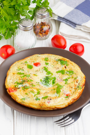 Omelet with broccoli and tomato, delicious healthy Breakfast, traditional morning food for childrenの写真素材