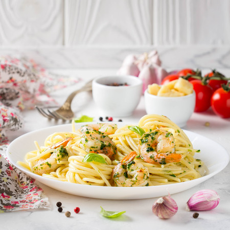 Italian pasta, spaghetti with shrimp, herbs, garlic and cheese. Delicious healthy foodの写真素材