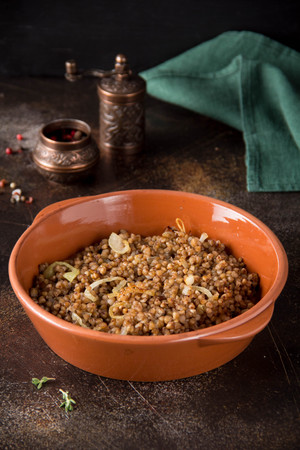 Russian traditional side dish buckwheat porridge with fried onions, delicious everyday dish.の写真素材
