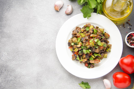 Vegetable stew with eggplant, zucchini, tomatoes, onions, mushrooms, garlic and cilantro. Vegetarian ajapsandali, Italian caponata. Traditional saute Ratatouilleの写真素材