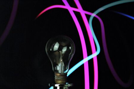 Bulb in the foreground. Colored waves background