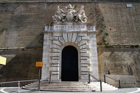 Main entrance of the Vatican museums. Portal with sculptural marble group.の写真素材