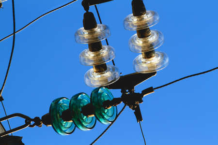 Detail of electric cables, light reflections on the glass of the lamps.の写真素材