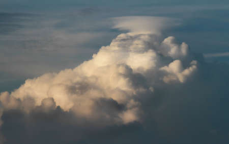 Cumulonimbus and anvil-shaped apex. Contrasts of light and shadow.の写真素材
