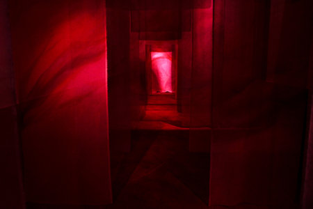 Art installation, succession of canvas panels illuminated by red light.の写真素材