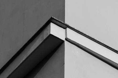 Italian urban architecture, detail of residential building, intersection of lines, minimalist black and white photo.の写真素材
