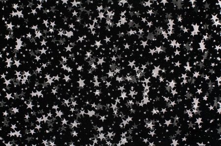 Black tulle fabric with white star designsの写真素材