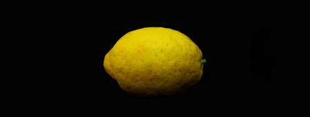 Sicilian lemon with a thick yellow skin, ideal for the "limoncello" liqueur. Black background.の写真素材