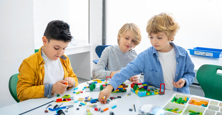 Robotics programming class. Children construct and code Robot. STEM education using constructor blocks and laptop, remote control joystick. Technology educational development for school kids. Advertisement copy spaceの写真素材