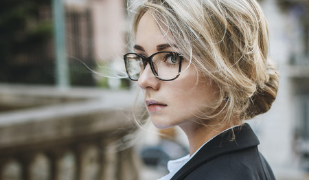Horizontal portrait of beautiful blonde woman in glasses, copy spaceの写真素材