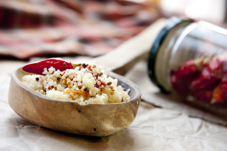 Couscous  on wooden backgroundの写真素材