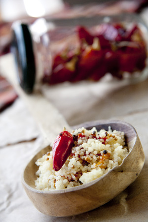 Couscous  on wooden backgroundの写真素材