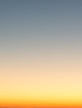 Concept of summer holidays, abstract blur sunset gradient sky background, blue and orangeの写真素材