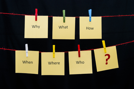 Several papers hanging with clips on two strings With the FAQsの写真素材