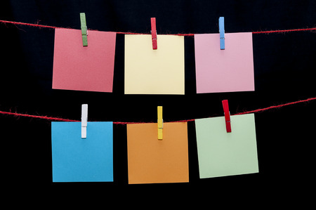 Color paper notes hanging on a ropeの写真素材