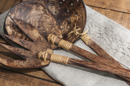 Rustic wooden cutlery on a napkinの写真素材