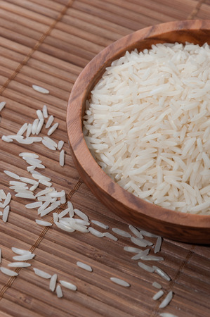 Basmati rice bowl on bamboo placematの写真素材